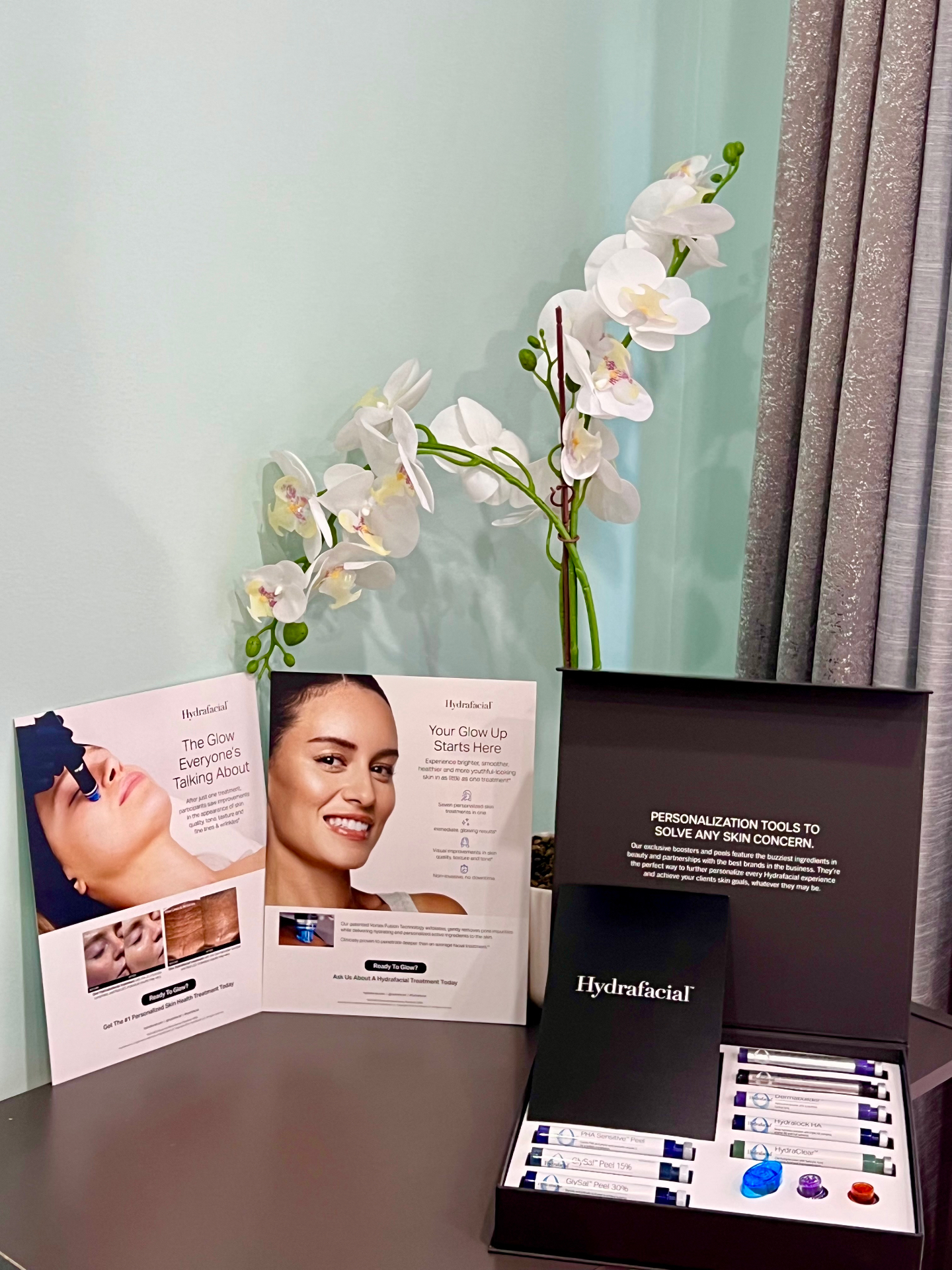 HydraFacial brochures and the HydraFacial booster and peel collection displayed at the Red Hook office